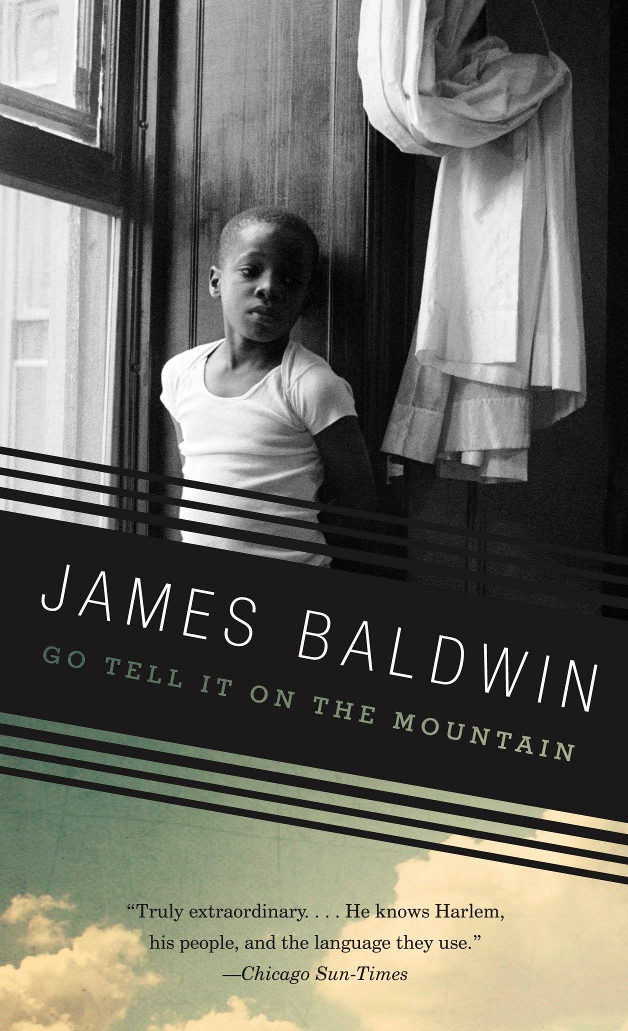 Book cover featuring a black and white photo of a black boy sitting in a window sill